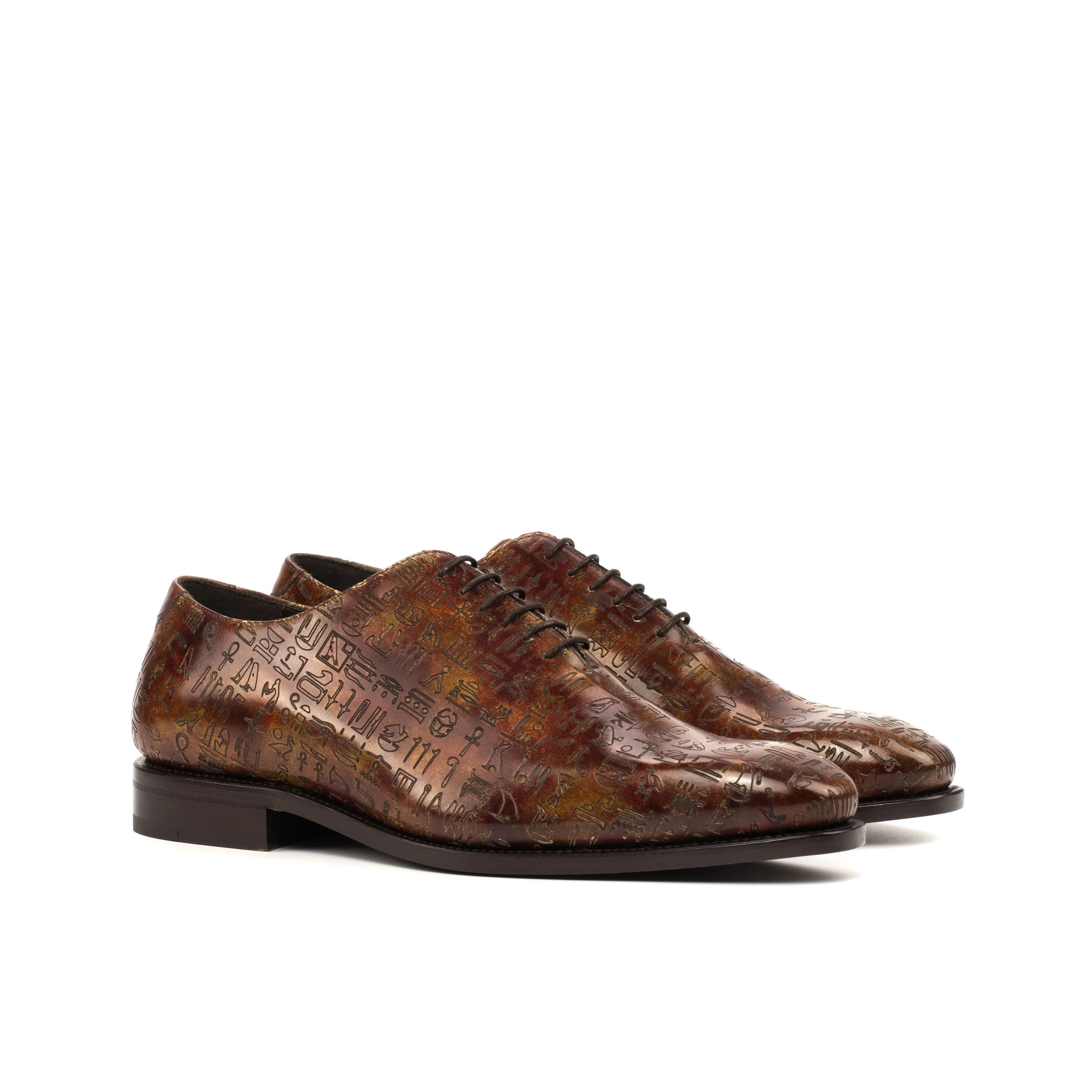 Egyptian patina wholecut brown leather dress shoes with hieroglyphic pattern