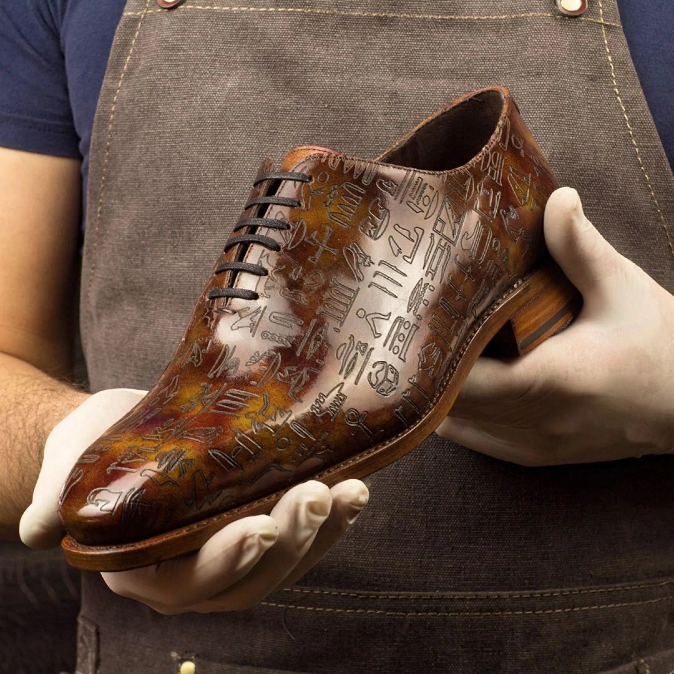 Egyptian patina wholecut brown leather dress shoe with hieroglyphic design