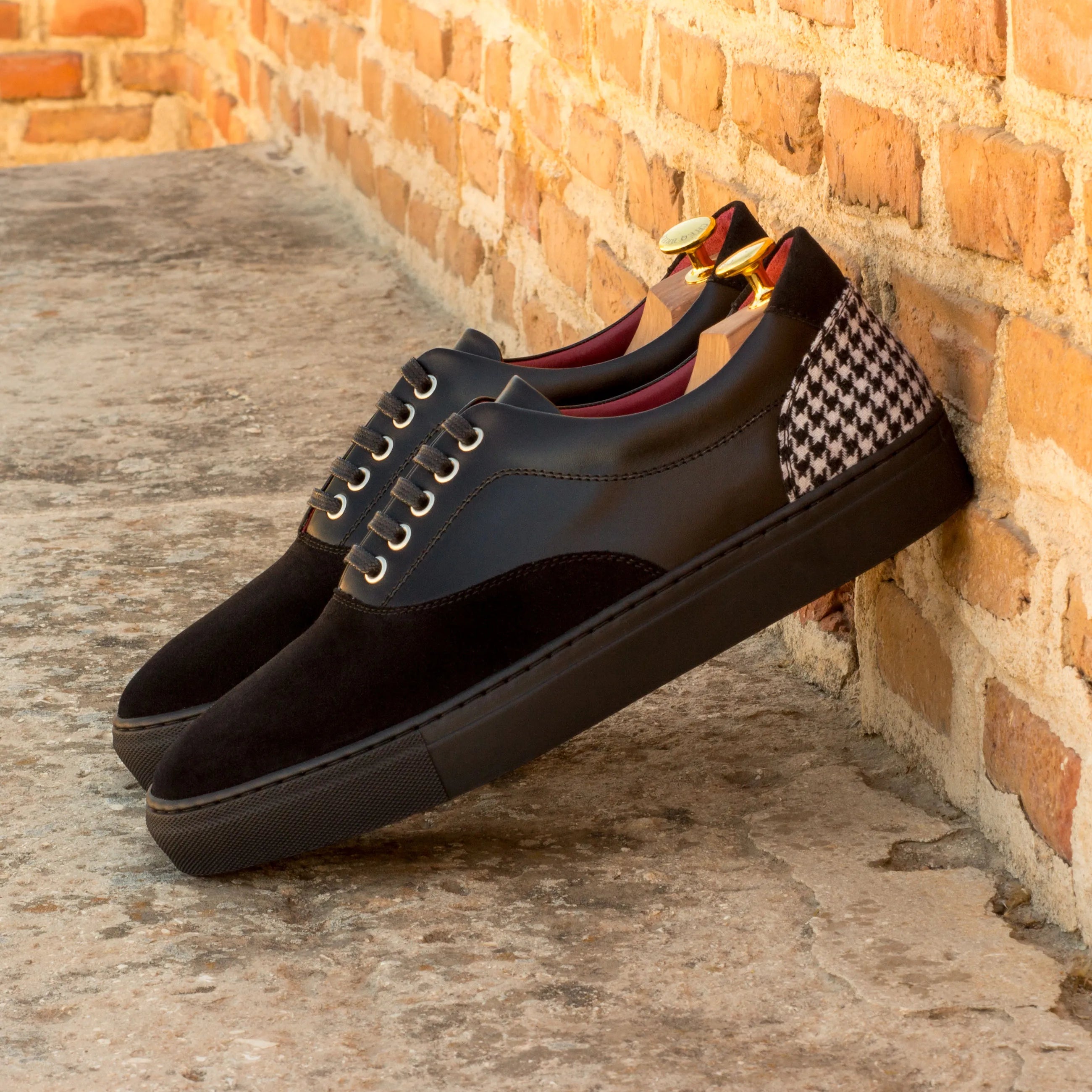 Back view of Euphemia Top Sider Sneaker in black leather with houndstooth heel