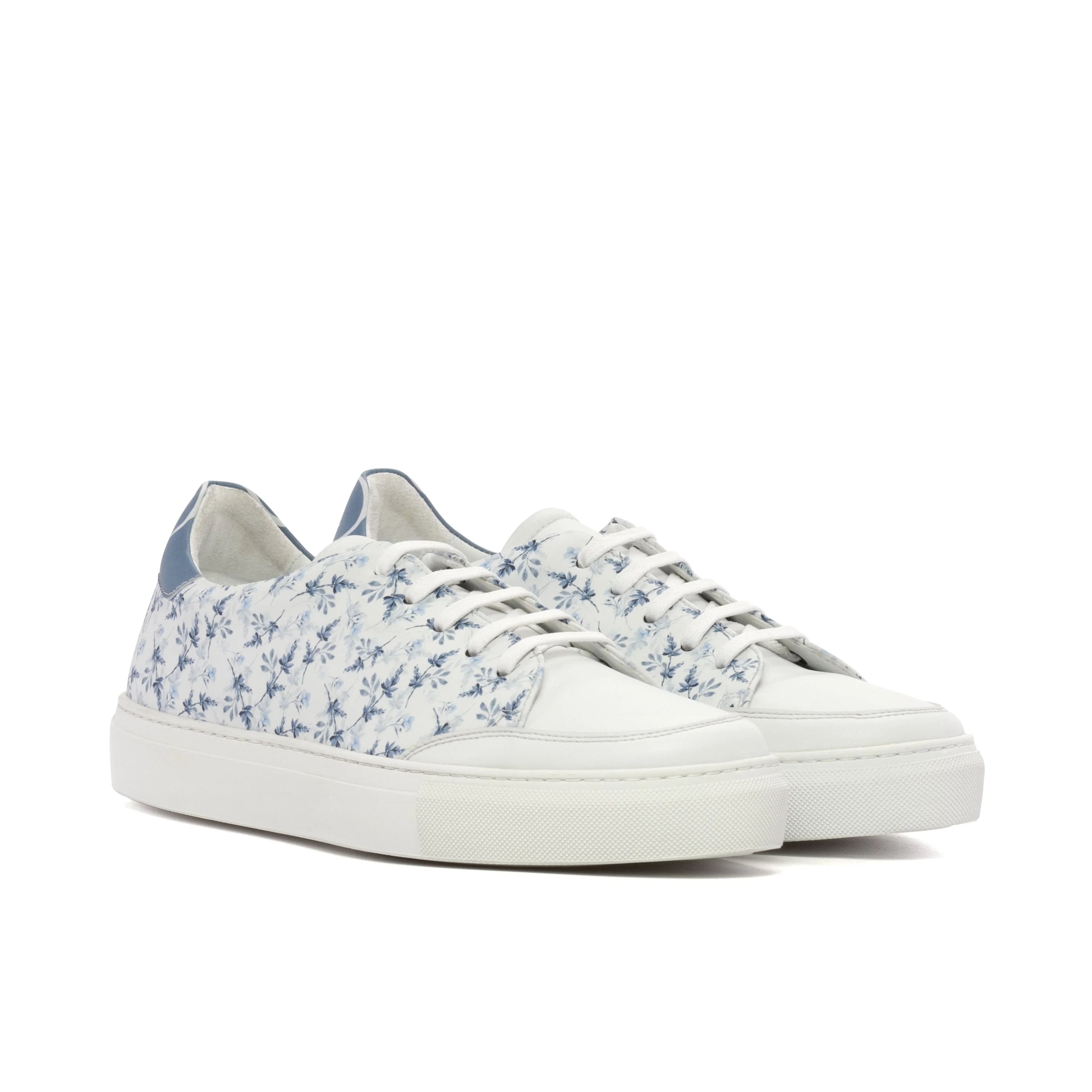 Solarisa unisex trainer sneakers in white with blue floral pattern