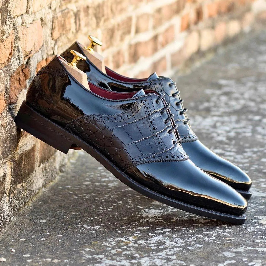 Shiny black Sorgino saddle shoes pair, rear view