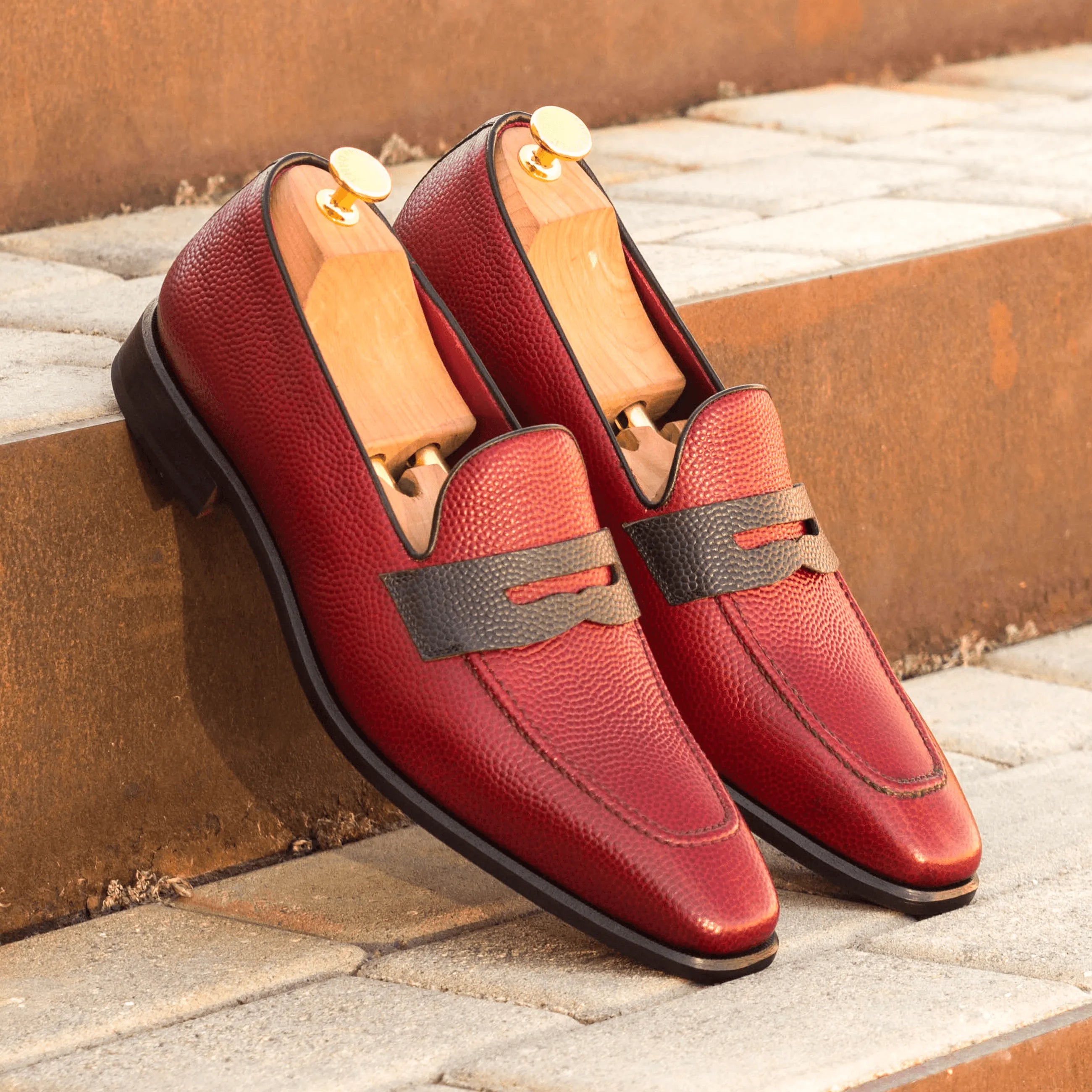 Pair of red pebble grain Tzu Loafers II luxury bespoke shoes for men