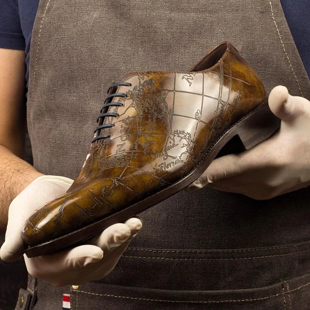 Worldly Patina Wholecut leather dress shoe with map design in Italian crust leather