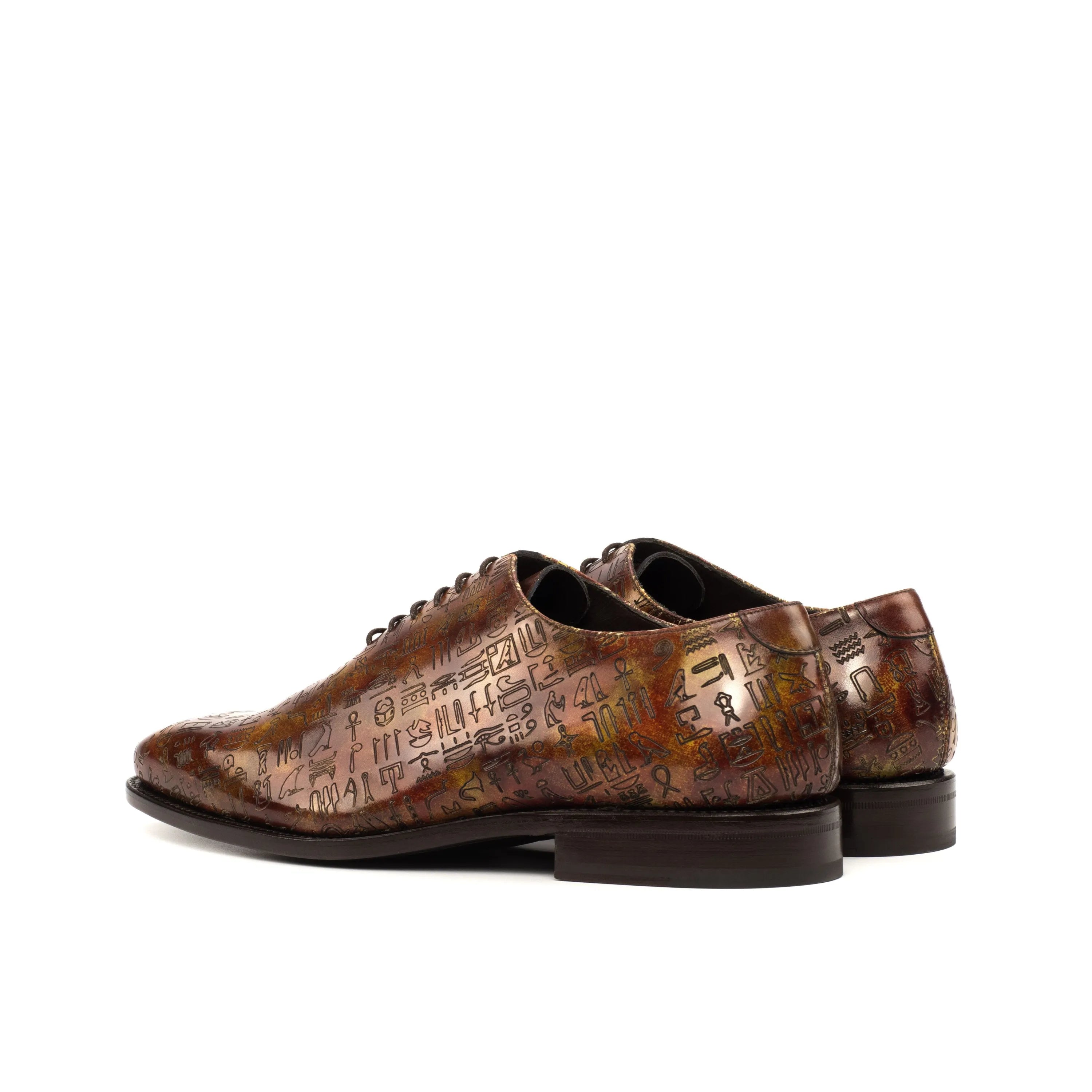 Egyptian patina wholecut brown leather dress shoes with hieroglyphic pattern