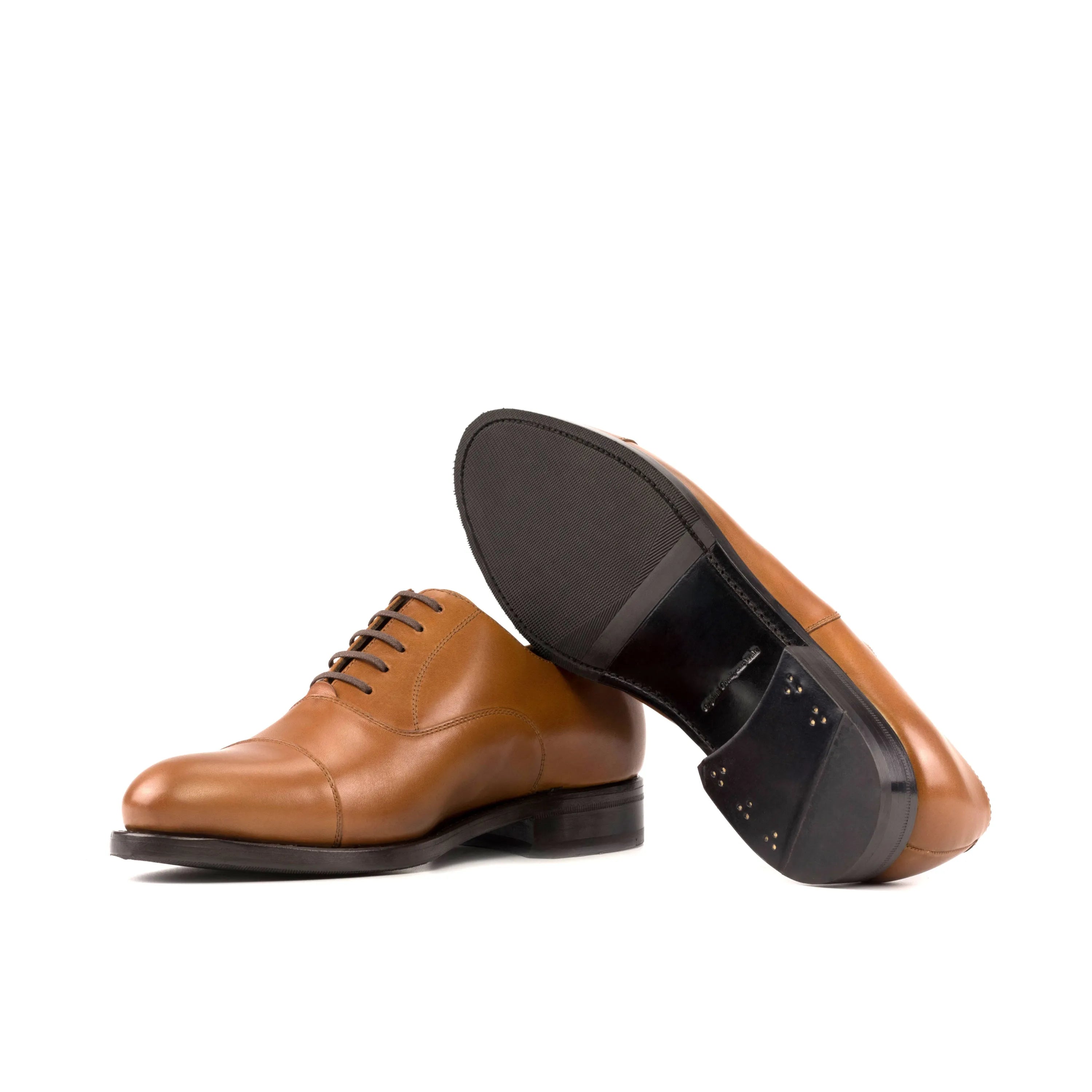 Pair of brown leather Klavio Oxford shoes in fast lane style