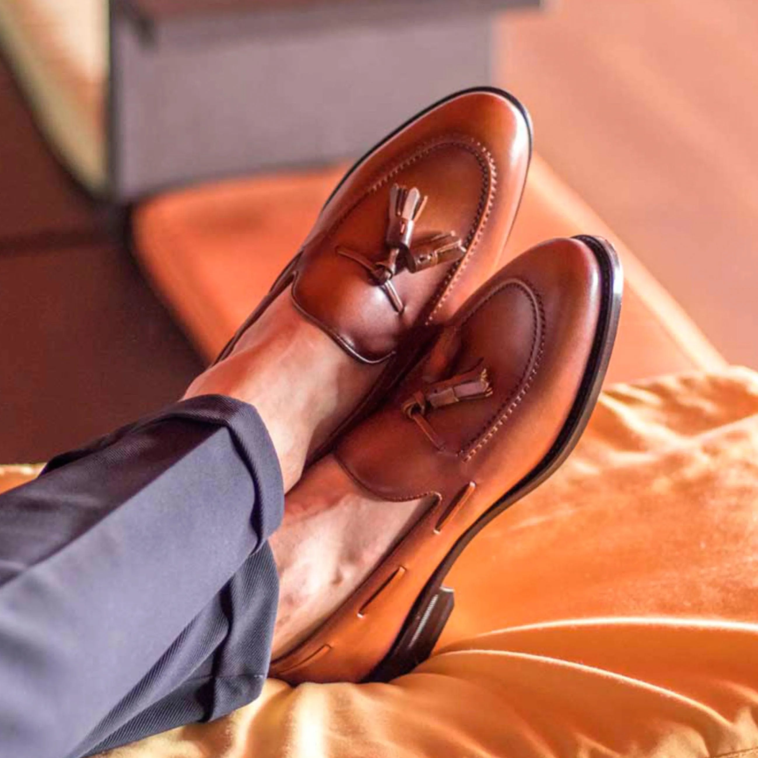Brown Leon loafers in leather with tassels, back view