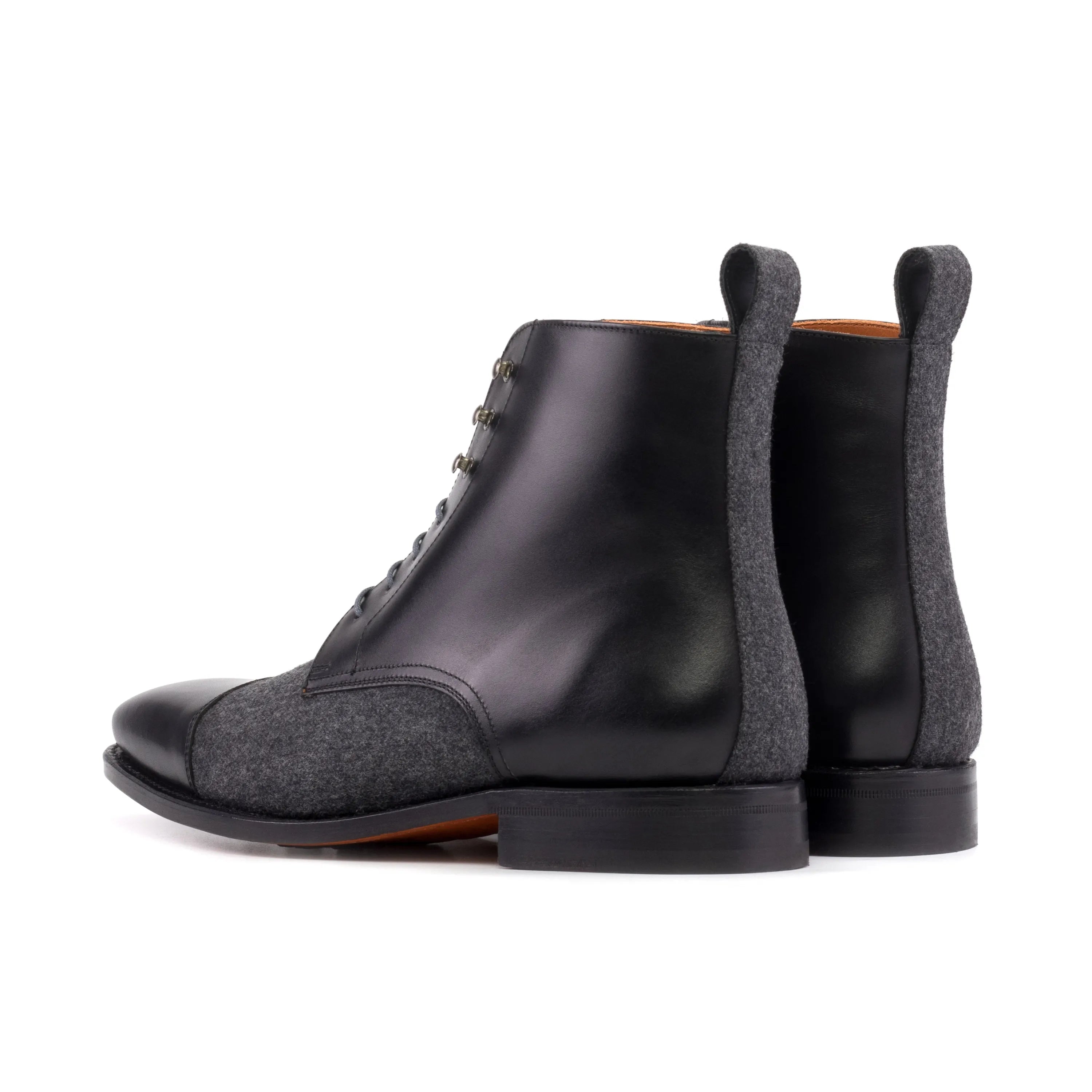 Zenobia jumper boots in black leather and gray tweed